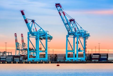 Picture of two cranes at a sea port 