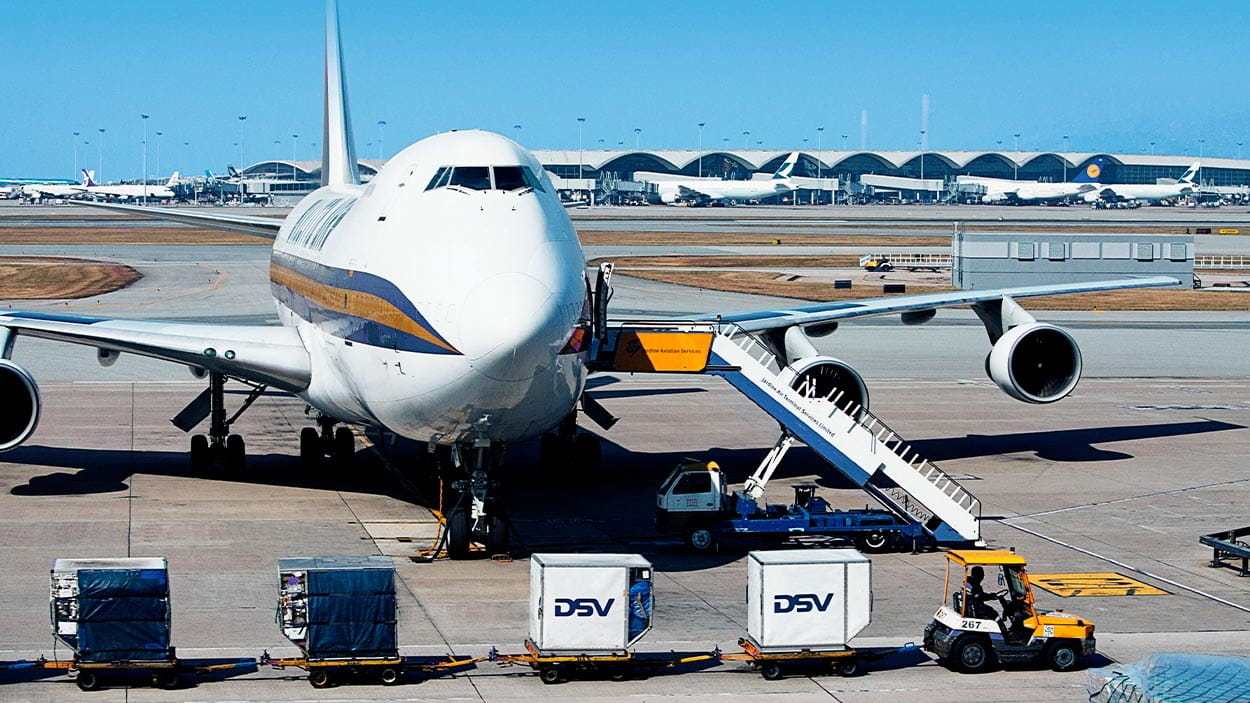 Airport logistics: DSV plane and loading containers.