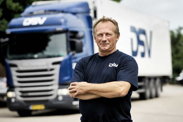 Haulier standing in front of his truck