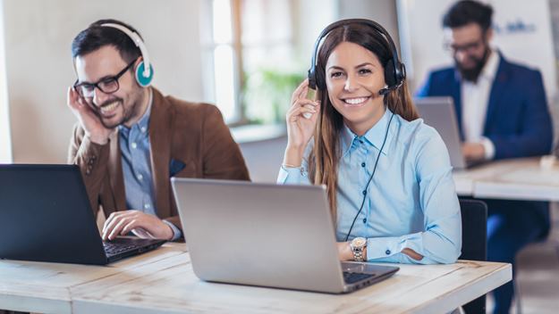 A picture of two DSV employees taking a call