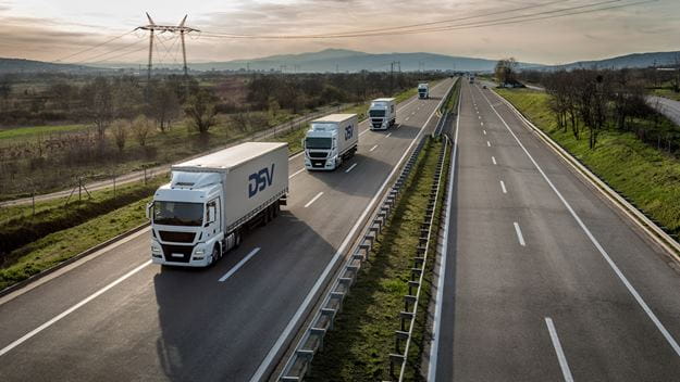 Conwoy of DSV trucks on the freeway