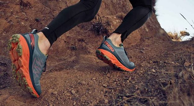 Woman hiking on a dirty road