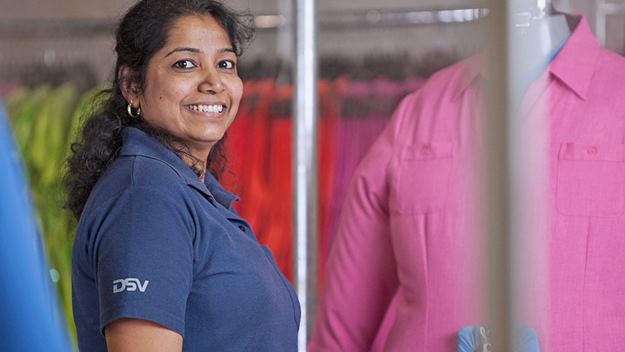 Female warehouse worker handling clothes