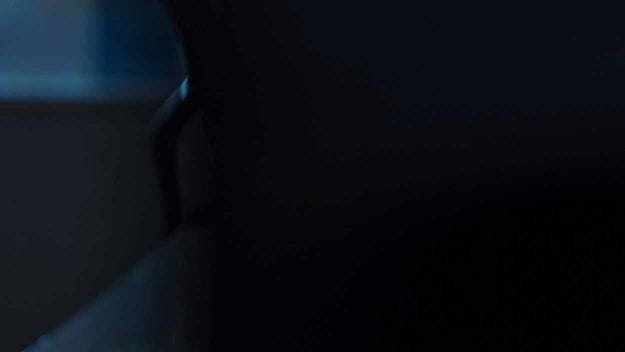 A man wearing a headset working at his desk in an office environment. One image is split into 6 separate images showing a part of the image