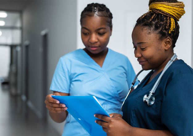 Healthcare nurses looking over a patient's chart