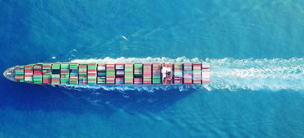 Commercial vessel sailing in blue water